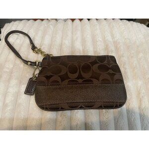B301 - Coach signature dark brown jacquard canvas wristlet with a brown glittery